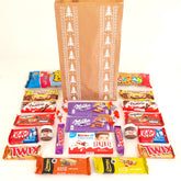 Bolsas kraft navideña, llena de chocolates, estampado árboles